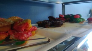 Rainbow and chocolate muffins on a tray