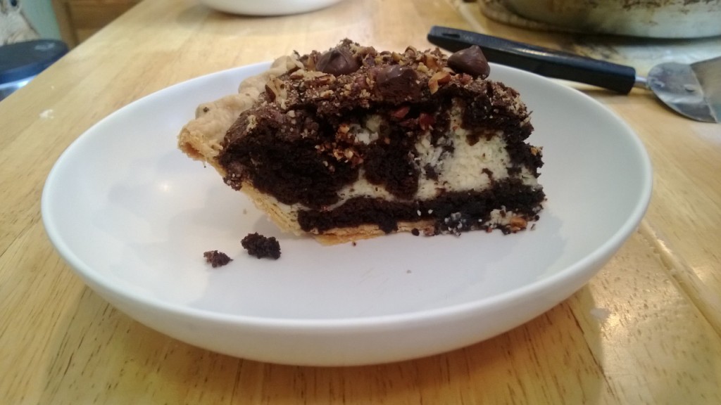 A slice of brownie cheesecake pie.